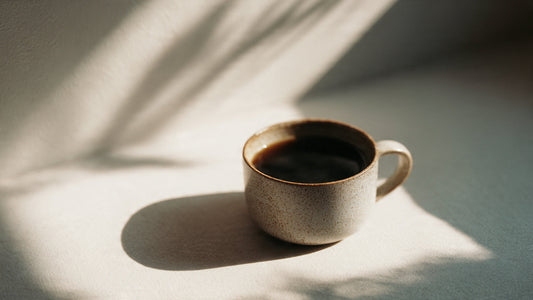 Editorial image of a simple coffee moment representing everyday coffee as a small luxury and daily ritual.