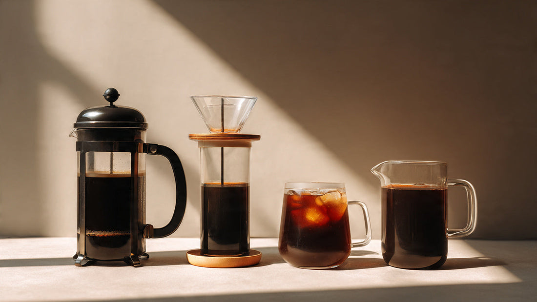 Different coffee brewing methods including French press, pour over, espresso, and cold brew on a clean surface