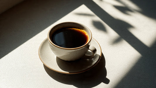 Kenyan single origin coffee in ceramic cup with bright citrus highlights and clean editorial styling