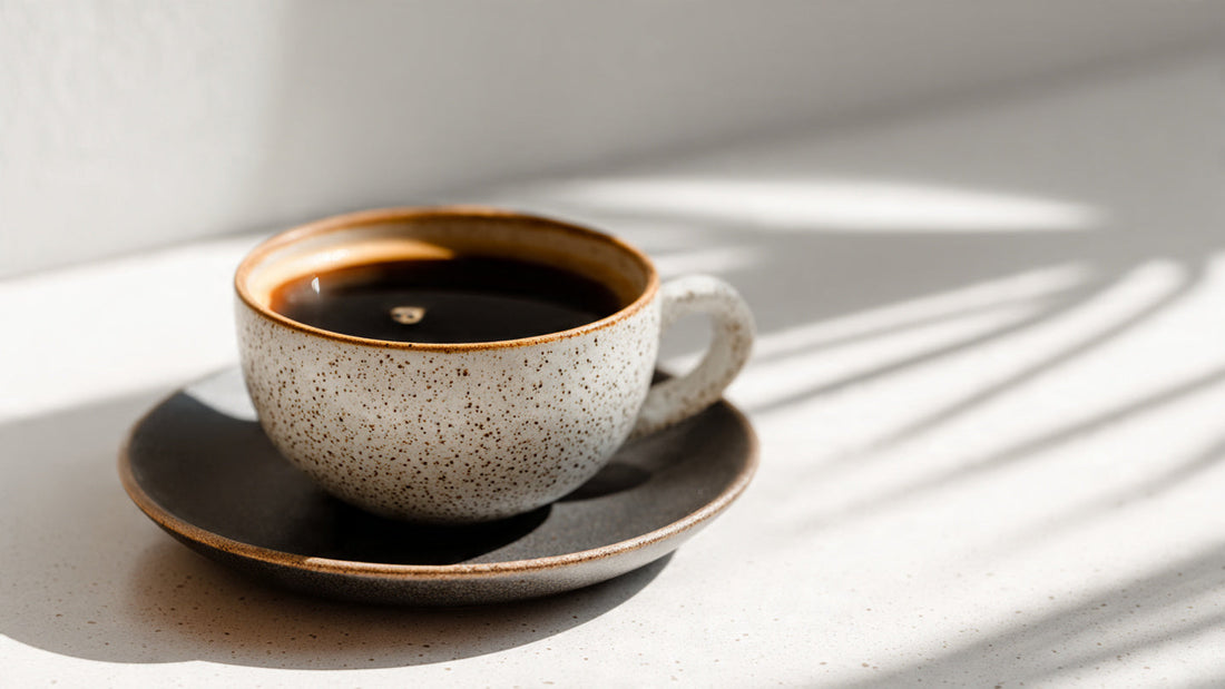 Costa Rican single origin coffee in ceramic cup with bright clean light and crisp editorial styling