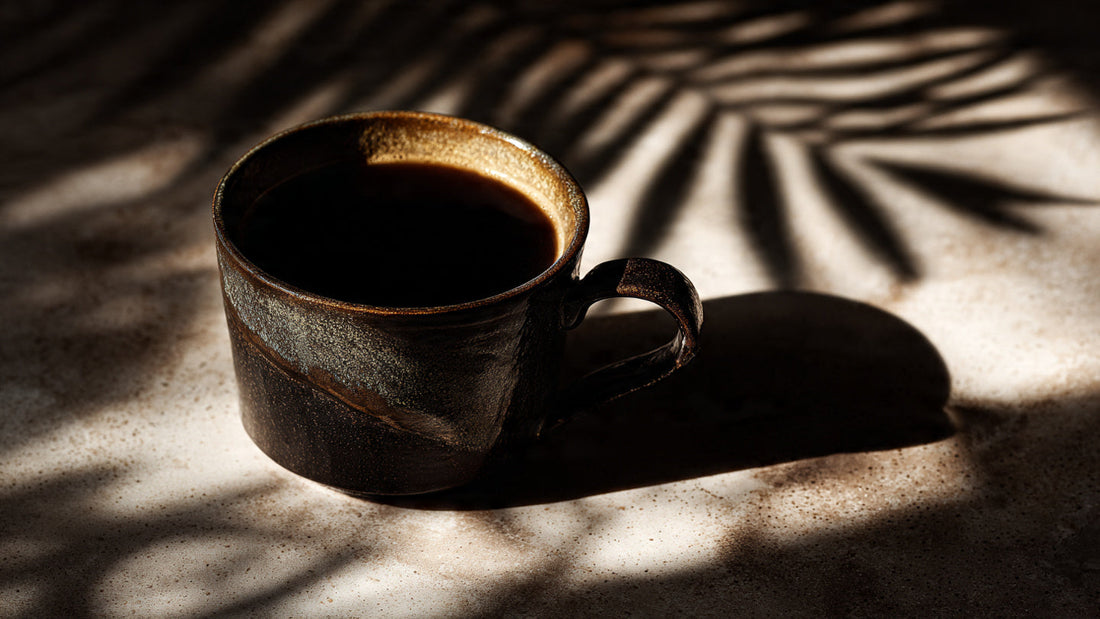 Sumatra single origin coffee in ceramic cup with earthy shadow tones and rainforest inspired