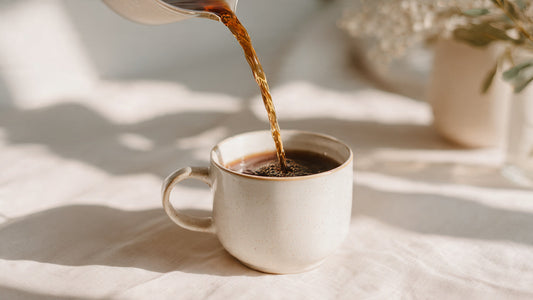 Breakfast Blend coffee poured into white mug on morning table.