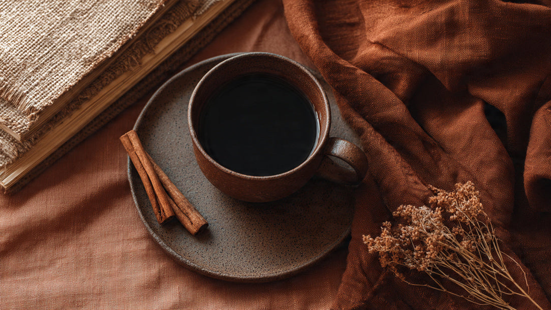 Mexican single origin coffee in ceramic cup with warm cinnamon-toned lighting and rustic editorial mood