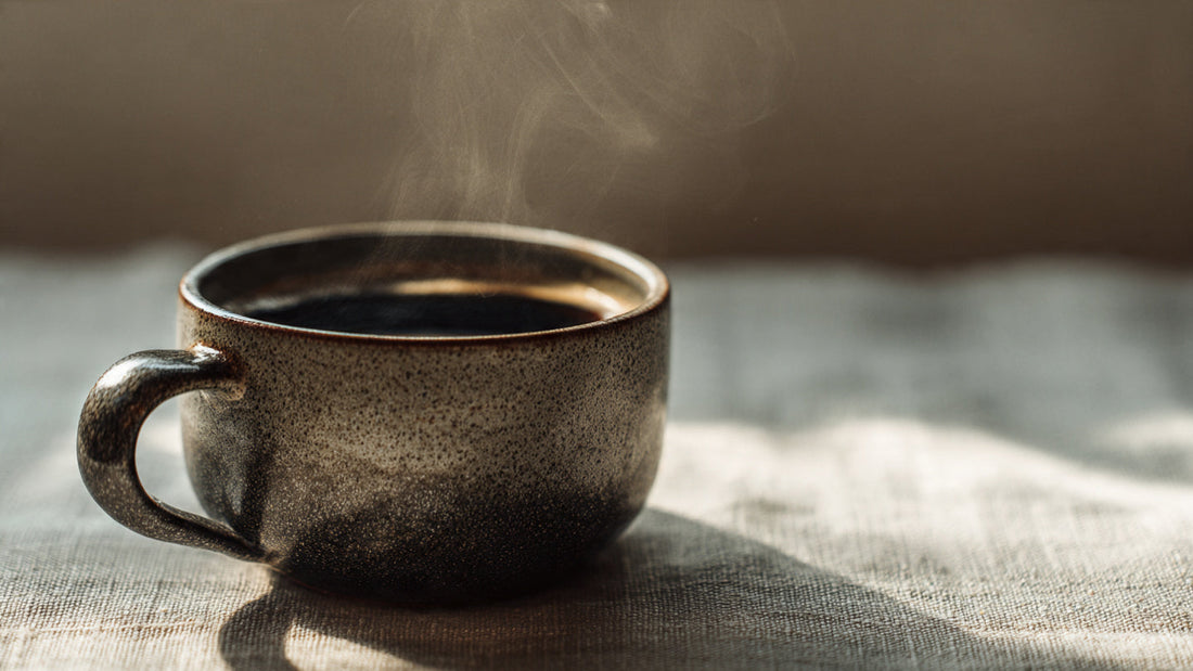 Ethiopian natural process coffee in ceramic cup with soft sunrise light and minimal editorial styling