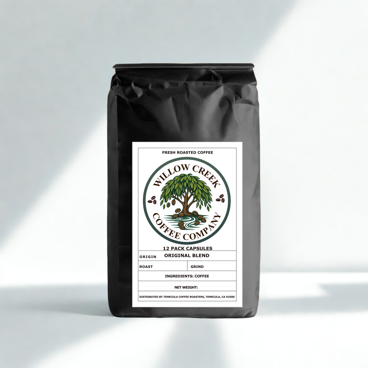 12-pack-original-roast-capsules. black coffee bag with willow creek coffee company label