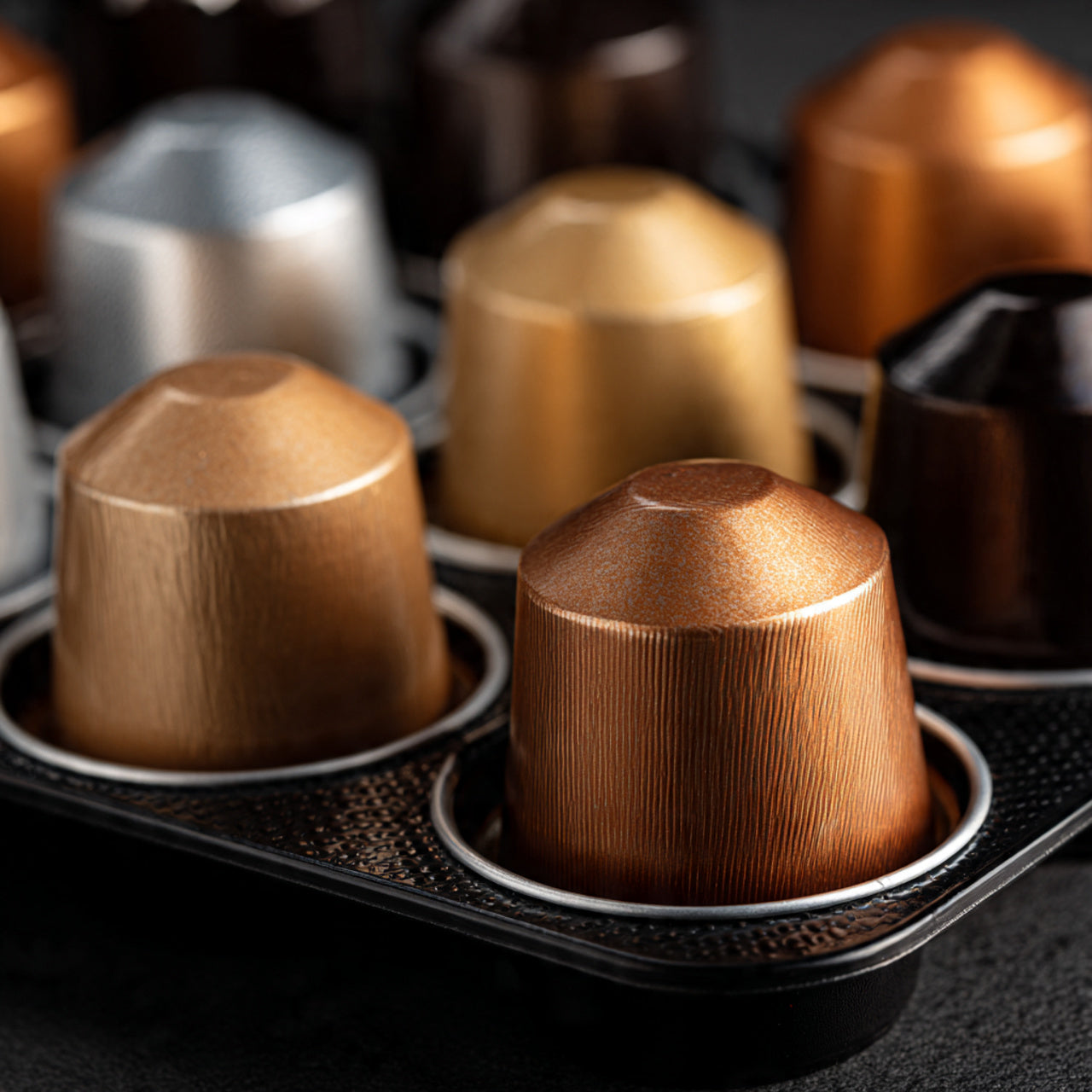 Close-up of 12 pk coffee capsules in a black holder