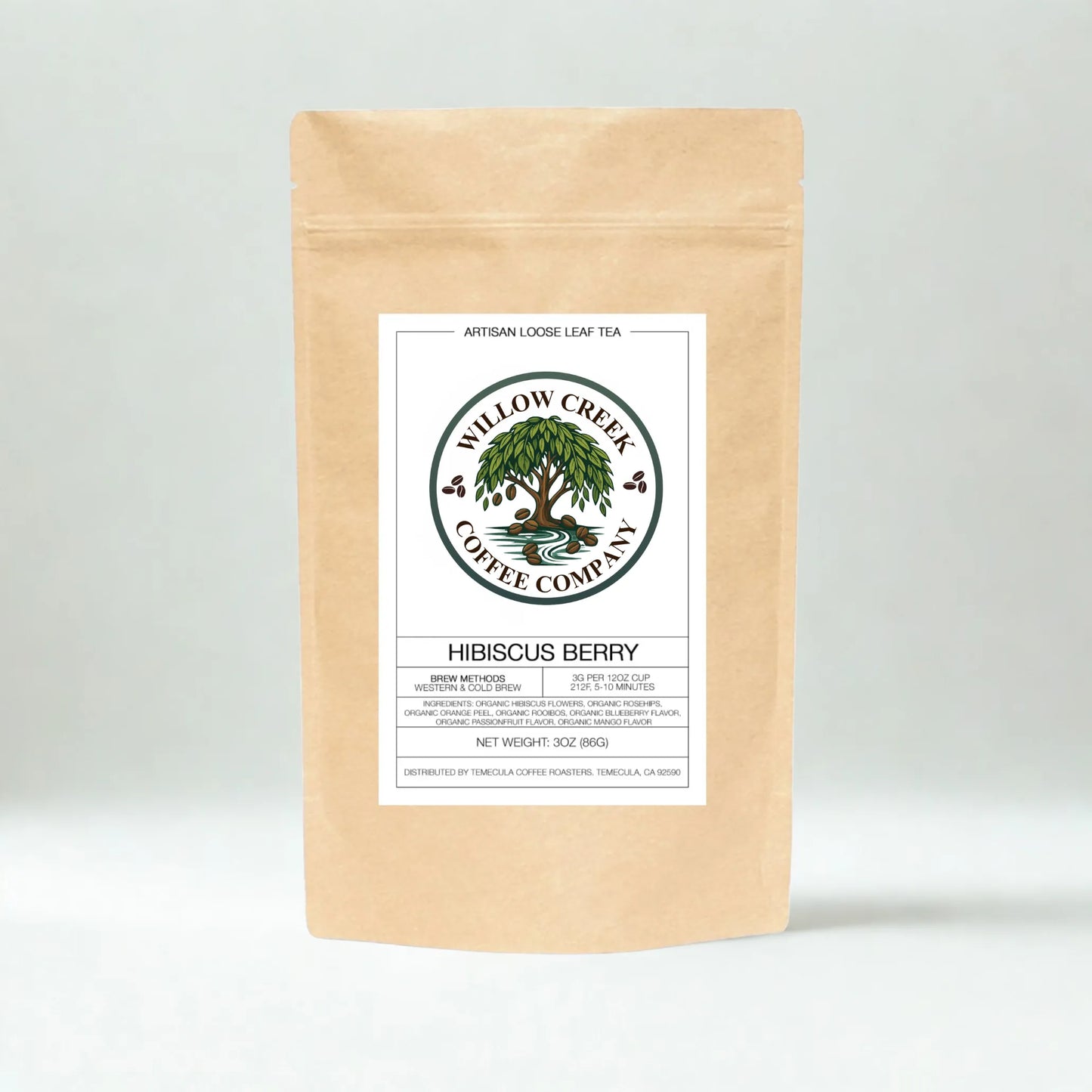 Kraft paper tea bag with Hibiscus Tea Willow Creek Coffee Company label on a light gray background