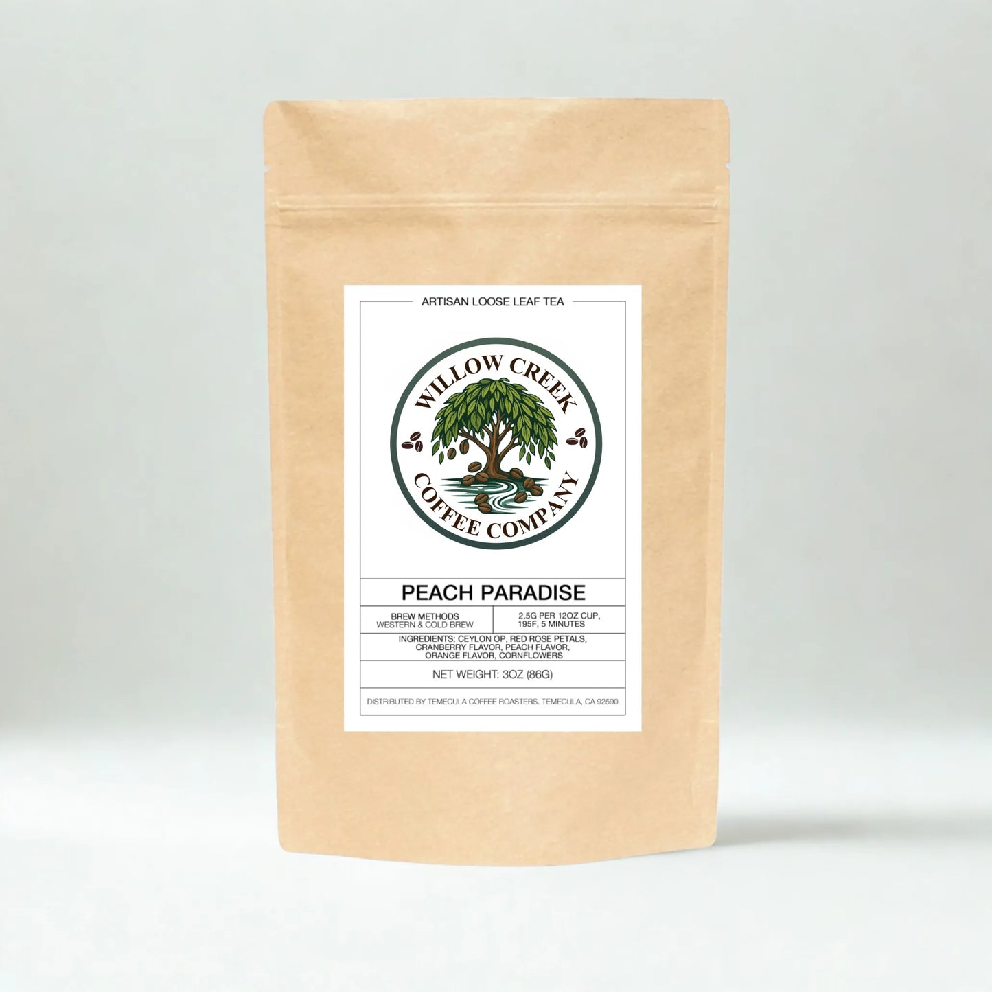 Kraft paper Peach Paradice tea bag with Willow Creek Coffee Company label on a light gray background