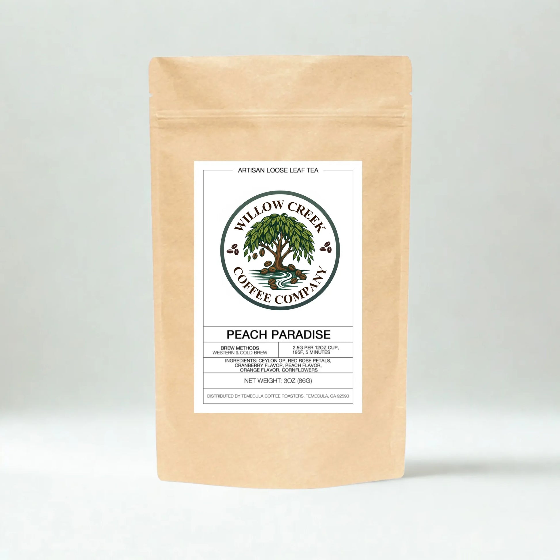Kraft paper Peach Paradice tea bag with Willow Creek Coffee Company label on a light gray background