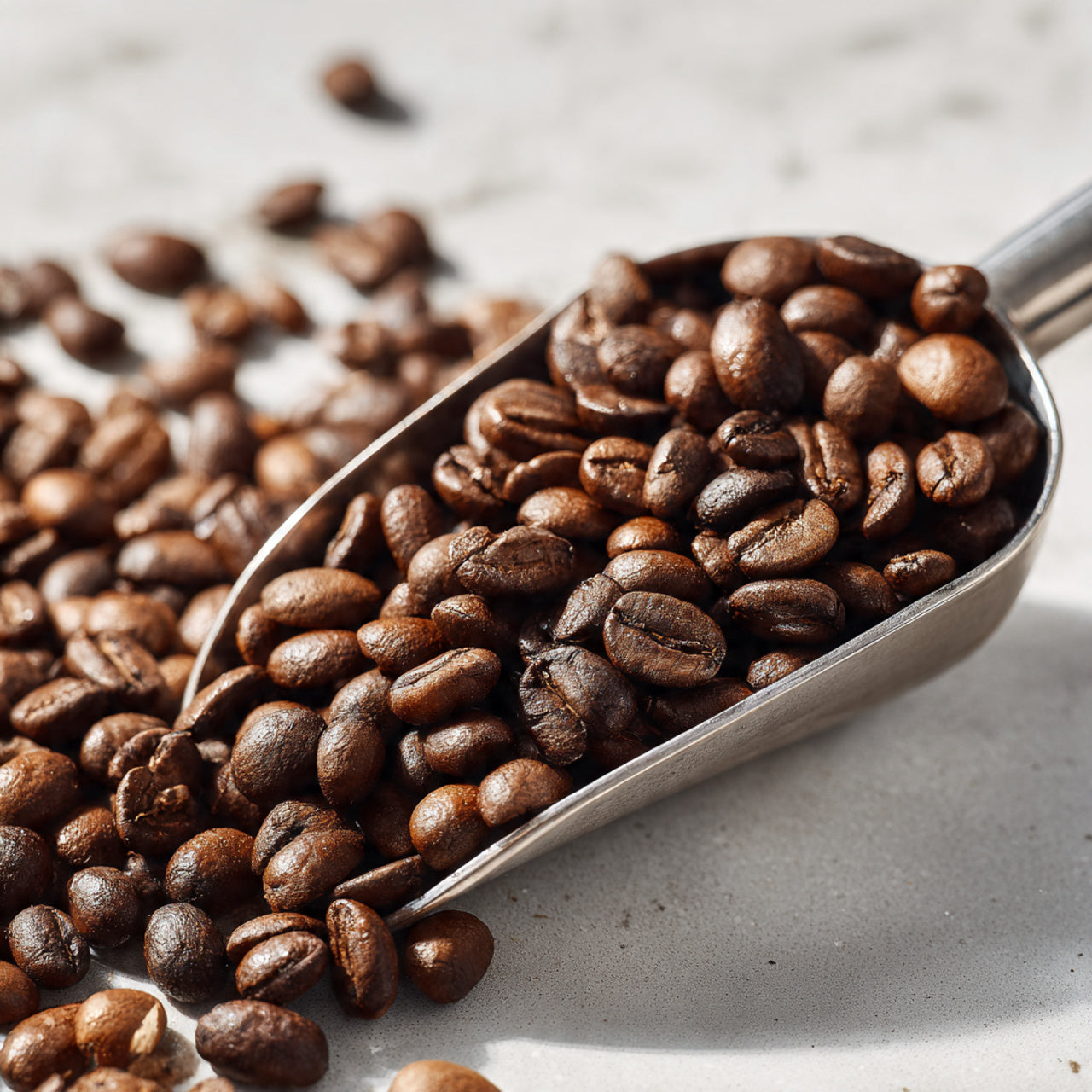 bali blue scoop filled with coffee beans on a light surface