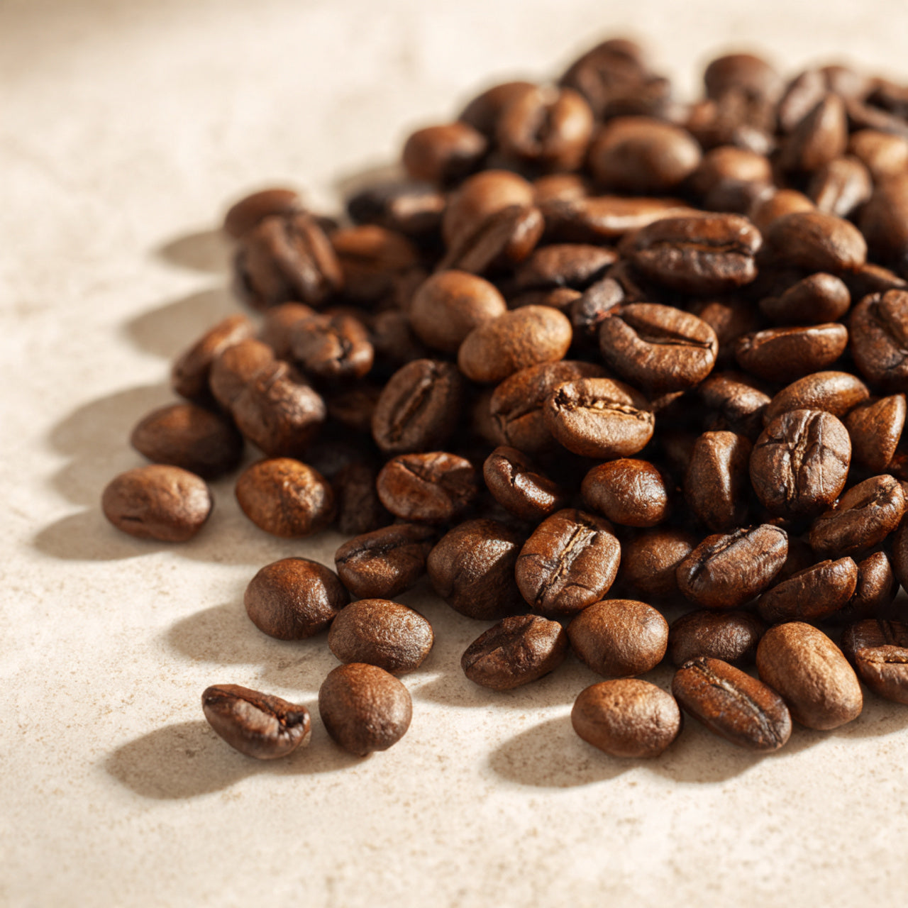 fresh roasted cinnabun coffee beans on a textured surface