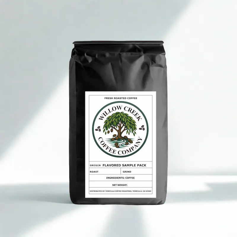 flavored coffee sample pack black coffee bag with Willow Creek Coffee Company label on a light gray background