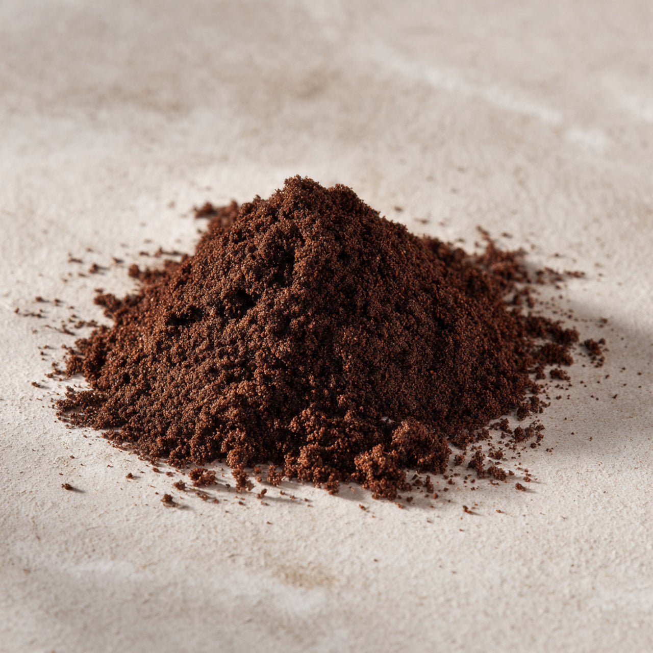 fresg ground gourmet donut shop coffee on a light brown surface