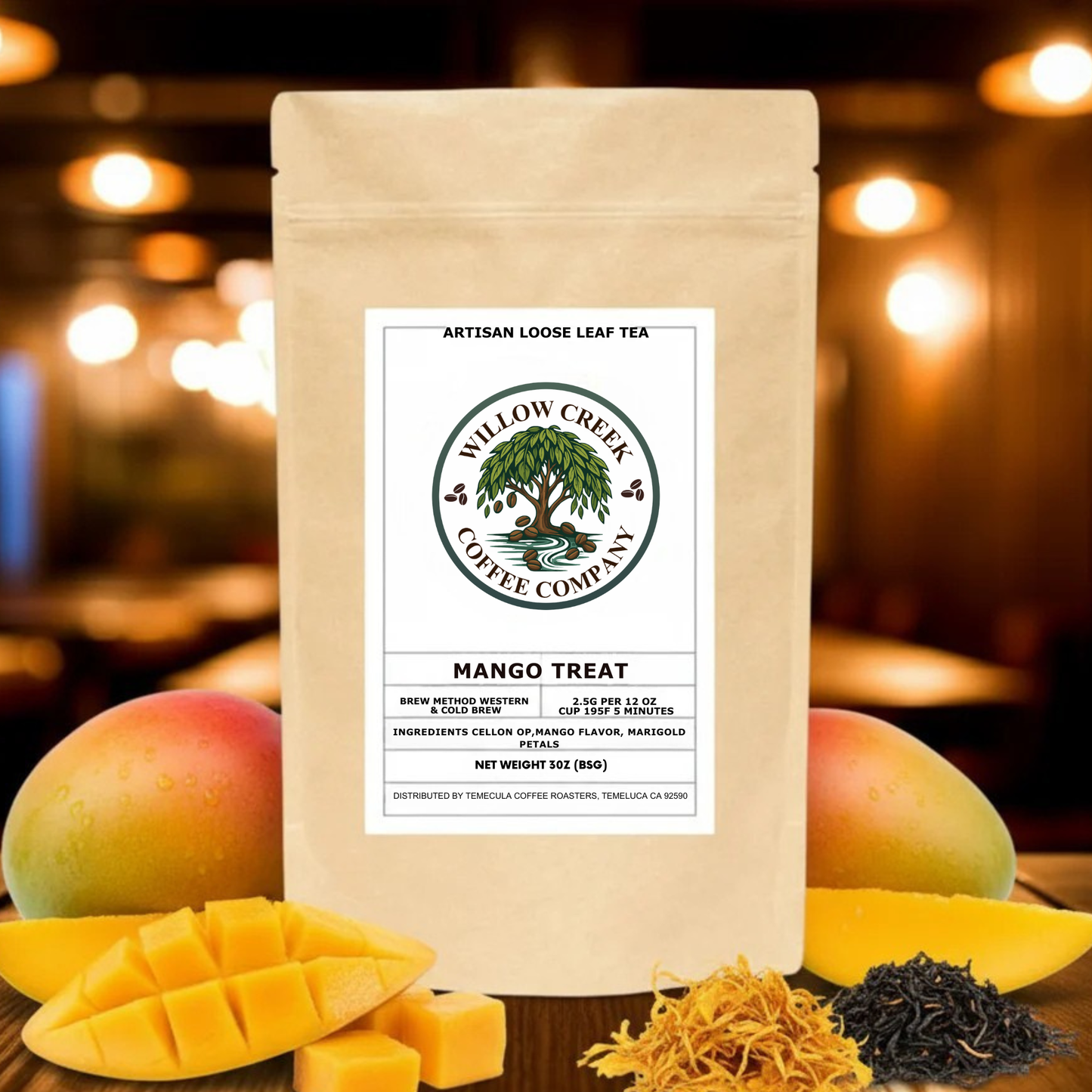 Tea package from Willow Creek Coffee Company with mangoes and tea leaves on a blurred background