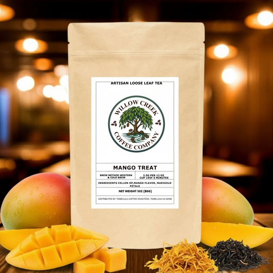 Tea package from Willow Creek Coffee Company with mangoes and tea leaves on a blurred background