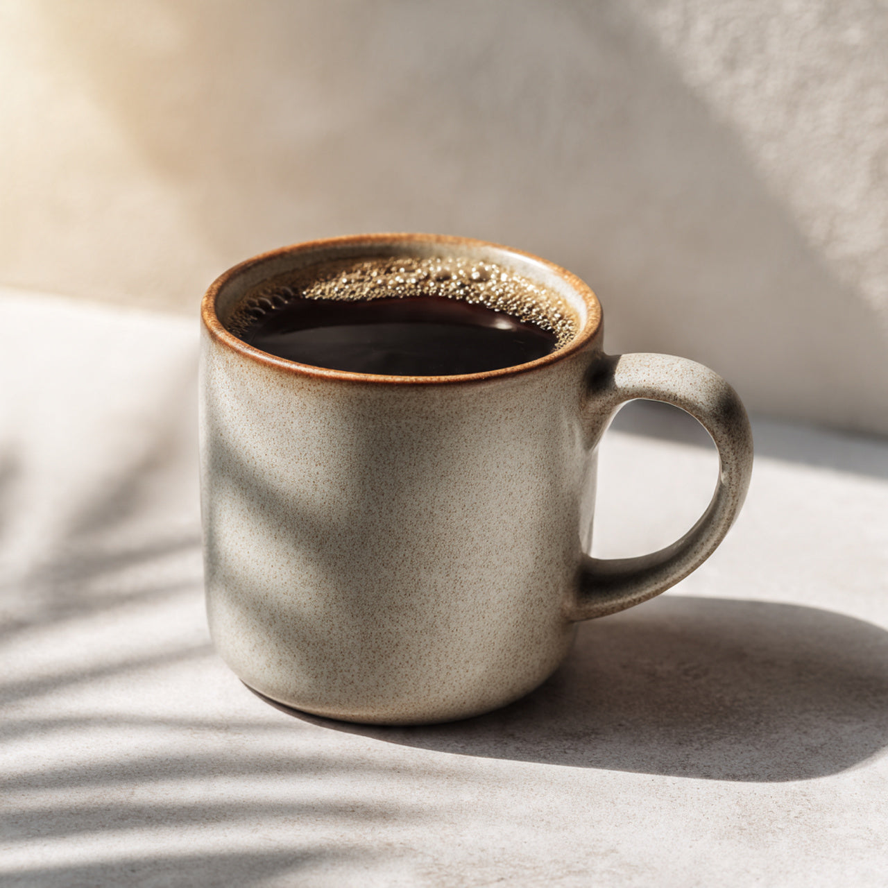 Ceramic mug with max caf coffee
 on a textured surface