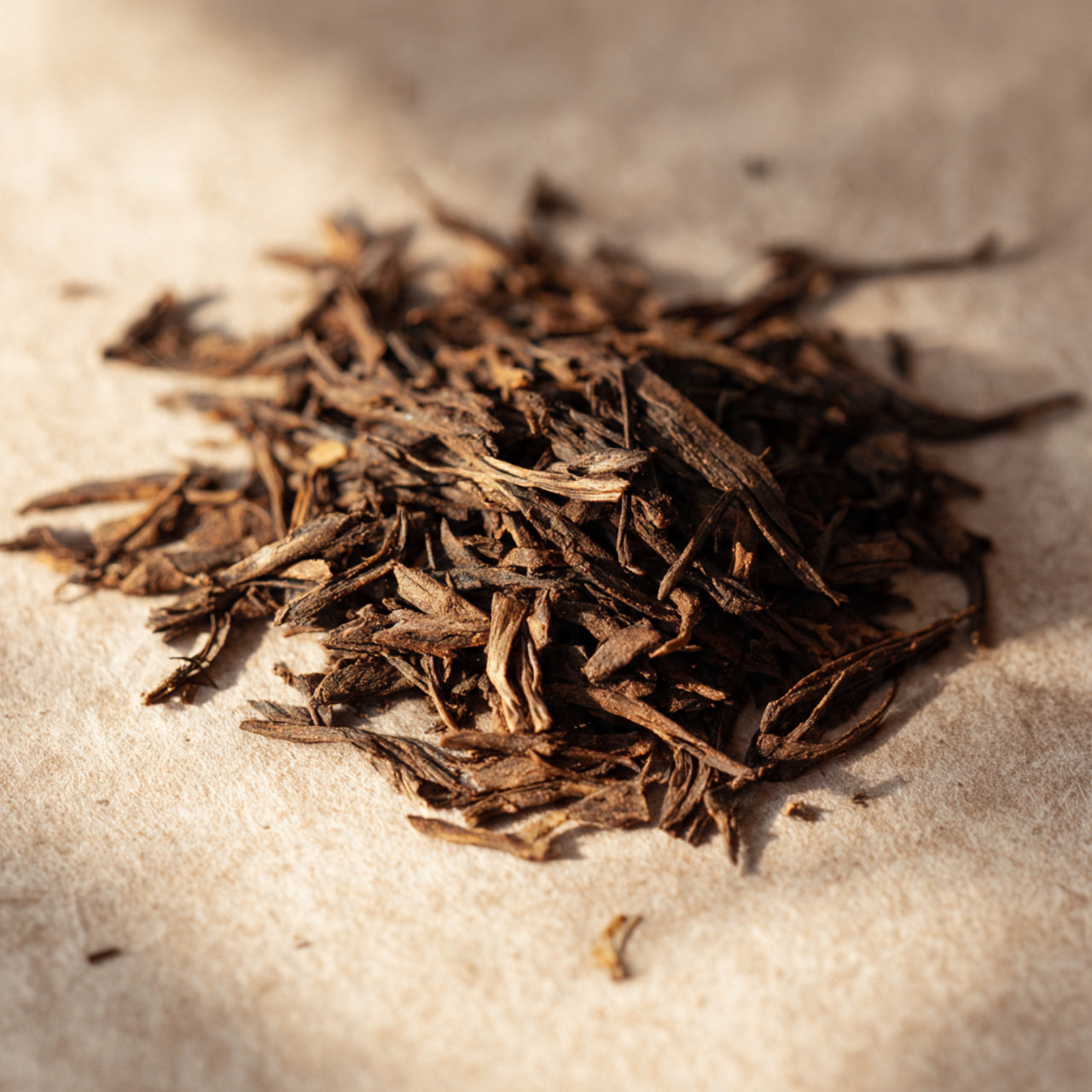 Loose hojicha tea leaves showing roasted texture.