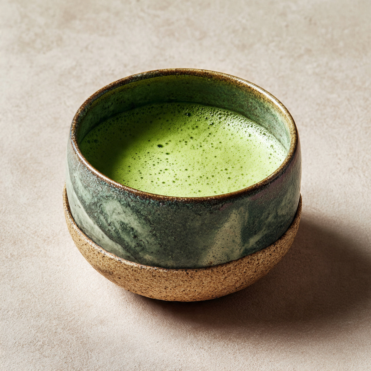 Prepared matcha tea in ceramic bowl.