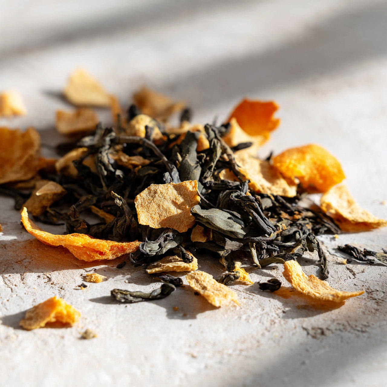 Loose mango tea with dried fruit pieces.