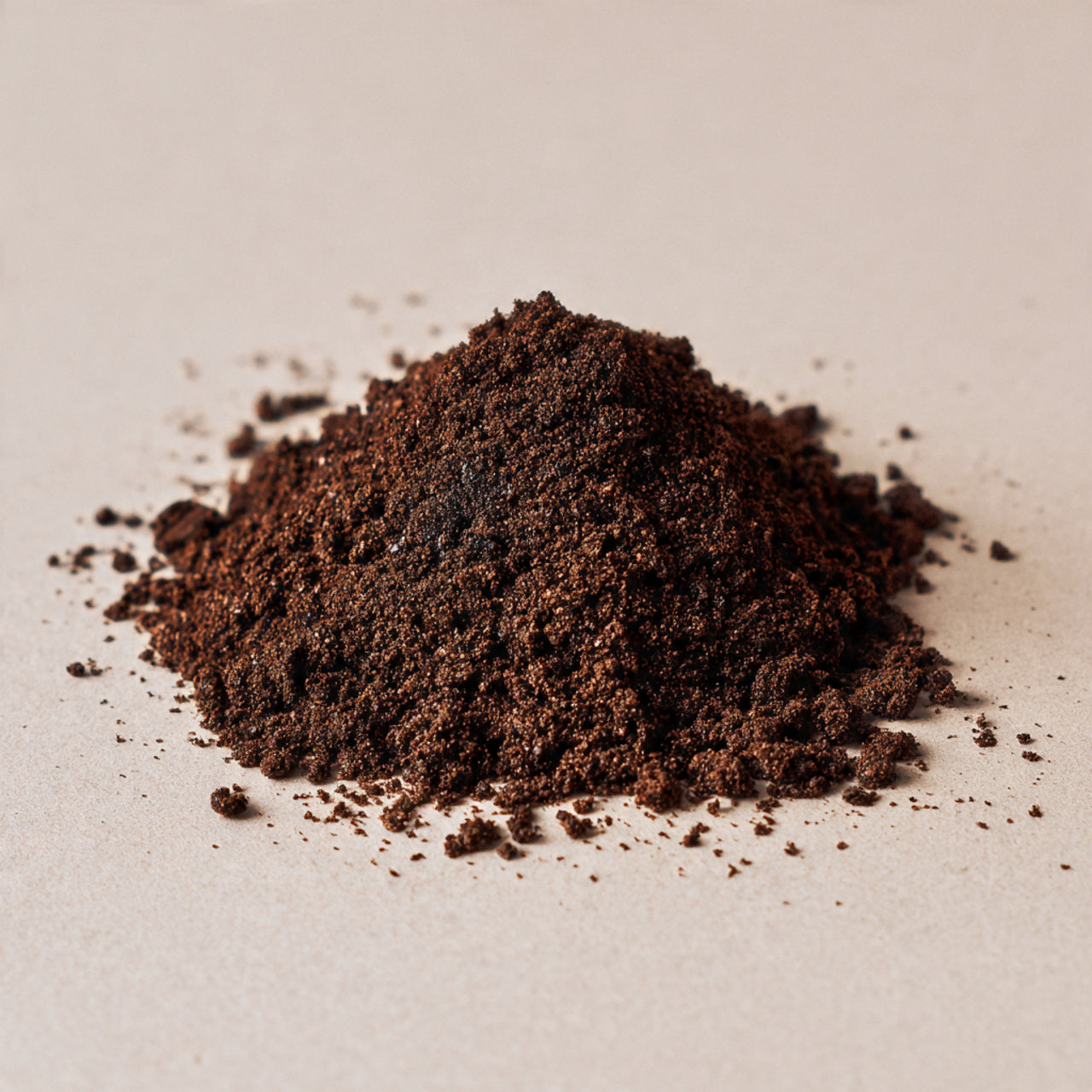 ground coffee on a beige background